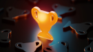 Trophy symbol glowing amid black trophy symbols.credit_istock-1503369669